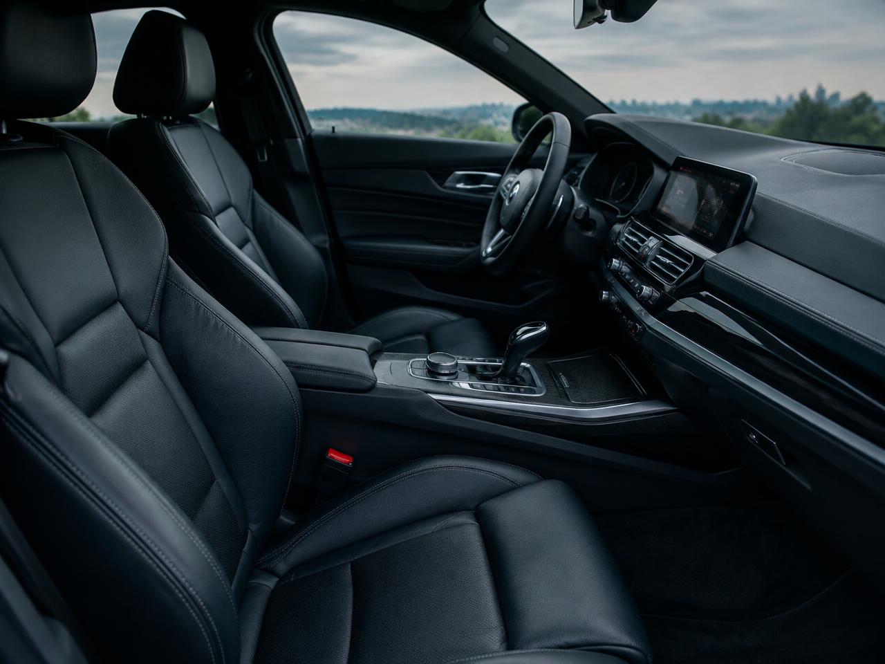 Clean black leather car interior and dashboard after a mobile interior detail in Sydney